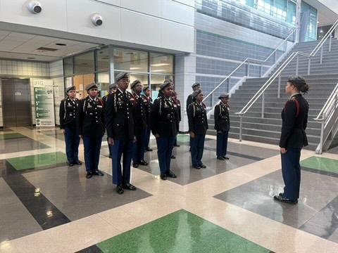  JROTC Students standing at attention in a hallway